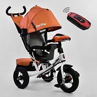 Фото детский трёхколесный велосипед best trike 7700 в – 6090: пульт включения света и звука, поворотное сиденье, надувные колеса переднее колесо d=29см. задние d=26см. оранжевый - Raspashonka.ua